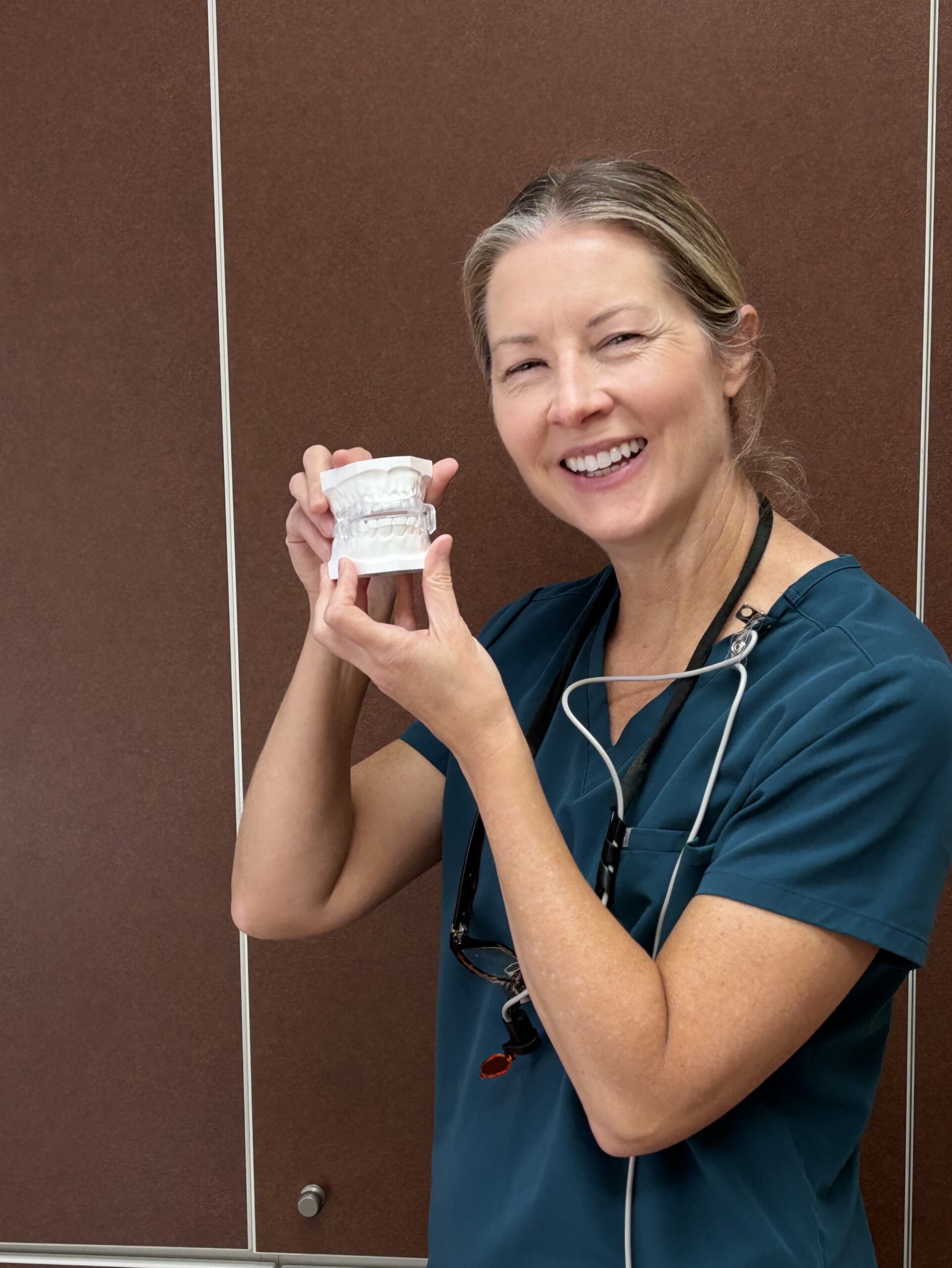 Dr. Diana Craft holding an oral sleep appliance
